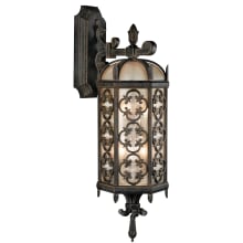 Costa del Sol Three-Light Outdoor Wall Sconce with Quatrefoil Details and Subtle Iridescent Textured Glass Shade