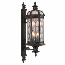 Devonshire 4 Light 39" High Outdoor Wall Sconce with Seedy Glass Shade