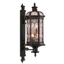 Devonshire Six-Light Outdoor Wall Sconce with Antiqued Gold Accents and Textured Seedy Glass