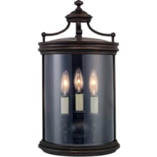 Louvre Three-Light Outdoor Wall Sconce with Antiqued Candles and Clear Blown Glass Shade
