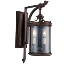 Louvre Two-Light Outdoor Wall Sconce with Antiqued Candles and Clear Blown Glass Shade