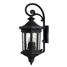 Raley 4 Light 31-1/4" Tall  Outdoor Wall Sconce with Clear Water Glass