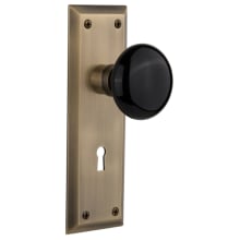 Black Porcelain Solid Brass Passage Door Knob Set with New York Rose, Keyhole and 2-3/4" Backset