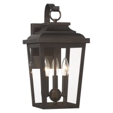 Irvington Manor 3 Light 17" Tall Outdoor Wall Sconce with Clear Glass