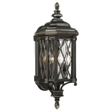 Bexley Manor 4 Light 25" Tall Outdoor Wall Sconce with Clear Beveled Glass