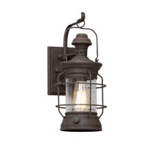 Atkins Single Light 6.75" Wide Hand Forged Outdoor Wall Sconce with Textured Glass Shade