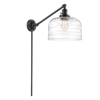 A thumbnail of the Innovations Lighting 237-13-12-L Bell Sconce Oil Rubbed Bronze / Clear Deco Swirl