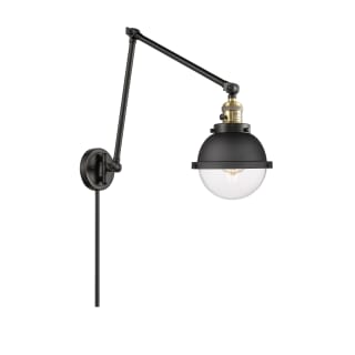 A thumbnail of the Innovations Lighting 238-11-7 Hampden Sconce Black Antique Brass / Clear