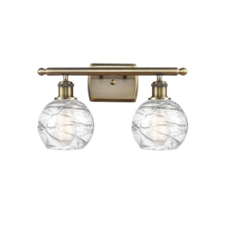 A thumbnail of the Innovations Lighting 516-2W-11-16 Athens Vanity Antique Brass / Clear Deco Swirl