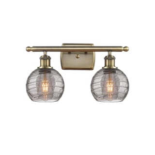 A thumbnail of the Innovations Lighting 516-2W-10-16 Athens Deco Swirl Vanity Antique Brass / Light Smoke Deco Swirl