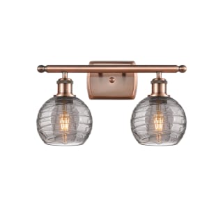 A thumbnail of the Innovations Lighting 516-2W-10-16 Athens Deco Swirl Vanity Antique Copper / Light Smoke Deco Swirl