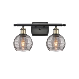 A thumbnail of the Innovations Lighting 516-2W-10-16 Athens Deco Swirl Vanity Black Antique Brass / Light Smoke Deco Swirl