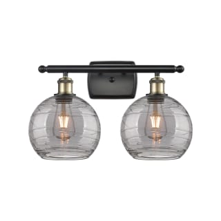 A thumbnail of the Innovations Lighting 516-2W-11-18 Athens Deco Swirl Vanity Black Antique Brass / Light Smoke Deco Swirl