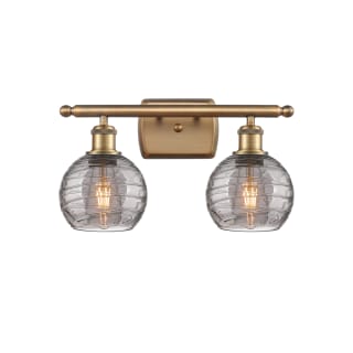 A thumbnail of the Innovations Lighting 516-2W-10-16 Athens Deco Swirl Vanity Brushed Brass / Light Smoke Deco Swirl