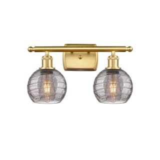 A thumbnail of the Innovations Lighting 516-2W-10-16 Athens Deco Swirl Vanity Satin Gold / Light Smoke Deco Swirl