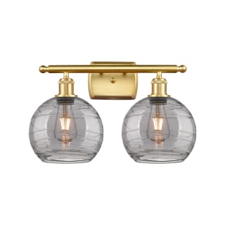 A thumbnail of the Innovations Lighting 516-2W-11-18 Athens Deco Swirl Vanity Satin Gold / Light Smoke Deco Swirl