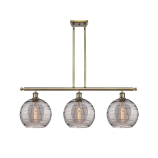 A thumbnail of the Innovations Lighting 516-3I 12 37 Athens Deco Swirl Chandelier Antique Brass / Light Smoke Deco Swirl