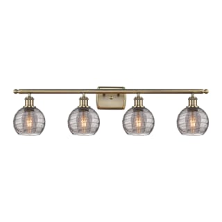 A thumbnail of the Innovations Lighting 516-4W 9 36 Athens Deco Swirl Vanity Antique Brass / Light Smoke Deco Swirl