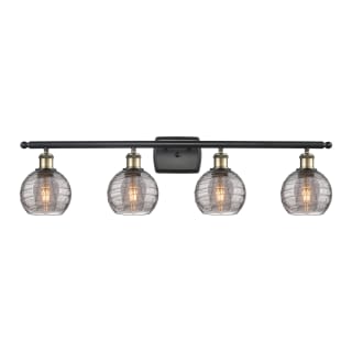 A thumbnail of the Innovations Lighting 516-4W 9 36 Athens Deco Swirl Vanity Black Antique Brass / Light Smoke Deco Swirl