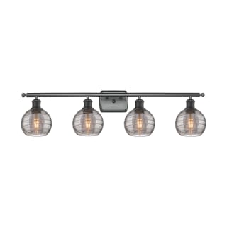 A thumbnail of the Innovations Lighting 516-4W 9 36 Athens Deco Swirl Vanity Matte Black / Light Smoke Deco Swirl