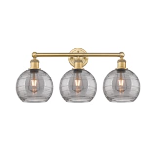 A thumbnail of the Innovations Lighting 616-3W 12 26 Athens Deco Swirl Vanity Brushed Brass / Light Smoke Deco Swirl