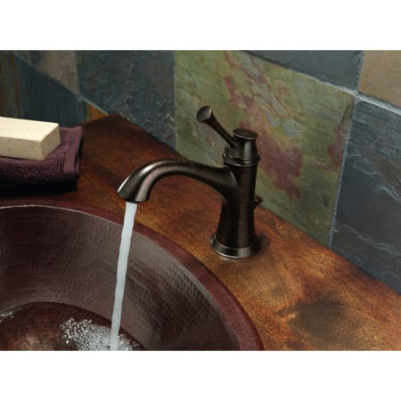 A large image of the Brizo 65005LF Brizo-65005LF-Faucet Running in Venetian Bronze