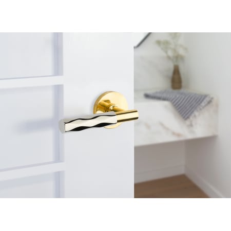 A large image of the Emtek 520TR Emtek-520TR-Polished Chrome Lever with Unlacquered Brass Rose