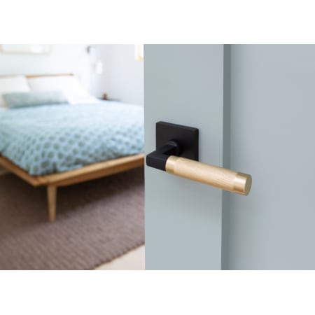 A large image of the Emtek C510KN Emtek-C510KN-Satin Brass Lever with Flat Black Square Rose