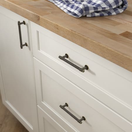 A large image of the Franklin Brass P29617K-B Warm Chestnut Hardware on White Cabinetry