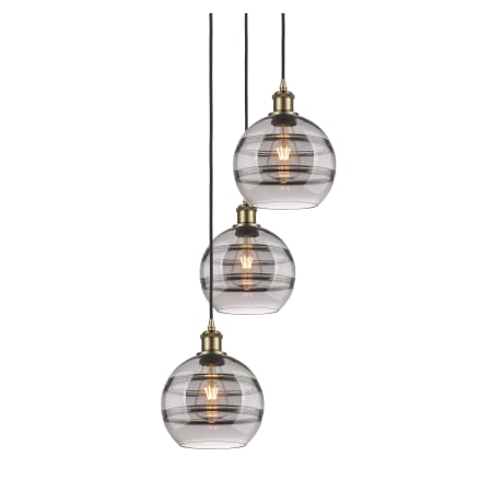 A large image of the Innovations Lighting 113B-3P-30-15 Rochester Pendant Antique Brass / Smoked