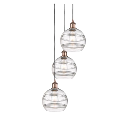 A large image of the Innovations Lighting 113B-3P-30-15 Rochester Pendant Antique Copper / Clear