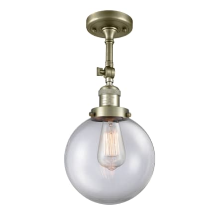 A large image of the Innovations Lighting 201F-8 Beacon Antique Brass / Clear