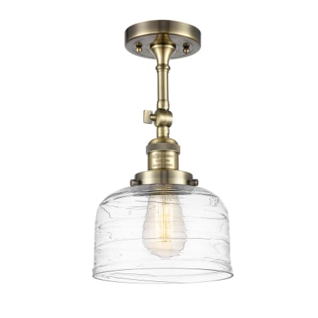 A large image of the Innovations Lighting 201F-14-8 Bell Semi-Flush Antique Brass / Clear Deco Swirl