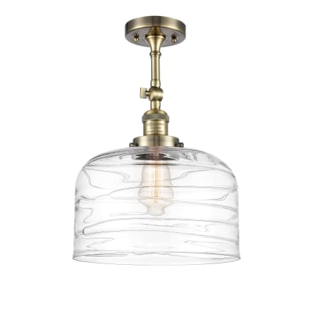 A large image of the Innovations Lighting 201F-16-12-L Bell Semi-Flush Antique Brass / Clear Deco Swirl