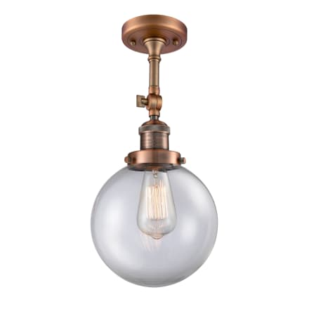 A large image of the Innovations Lighting 201F-8 Beacon Antique Copper / Clear