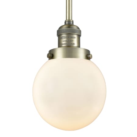 A large image of the Innovations Lighting 201S-6 Beacon Antique Brass / Matte White Cased