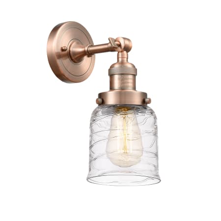 A large image of the Innovations Lighting 203-10-5 Bell Sconce Antique Copper / Deco Swirl