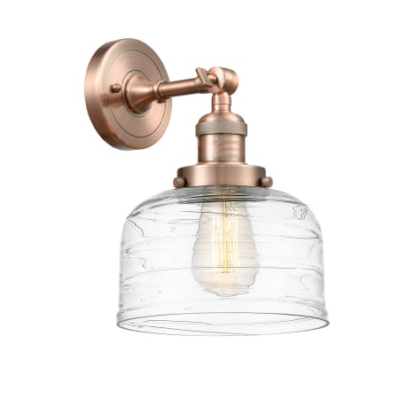 A large image of the Innovations Lighting 203-12-8 Bell Sconce Antique Copper / Clear Deco Swirl