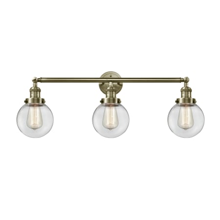 A large image of the Innovations Lighting 205-S-6 Beacon Antique Brass / Clear