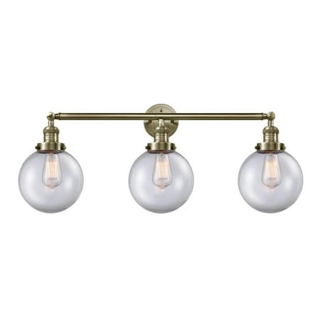 A large image of the Innovations Lighting 205-S-8 Beacon Antique Brass / Clear