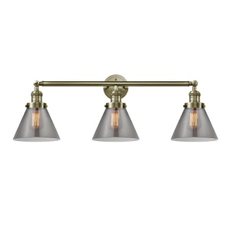 A large image of the Innovations Lighting 205-S Large Cone Antique Brass / Plated Smoke