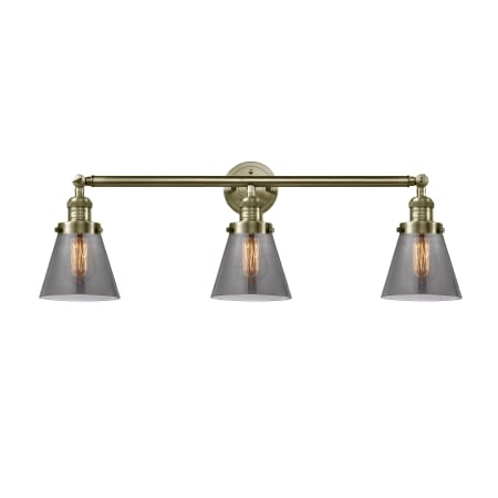 A large image of the Innovations Lighting 205-S Small Cone Antique Brass / Plated Smoke