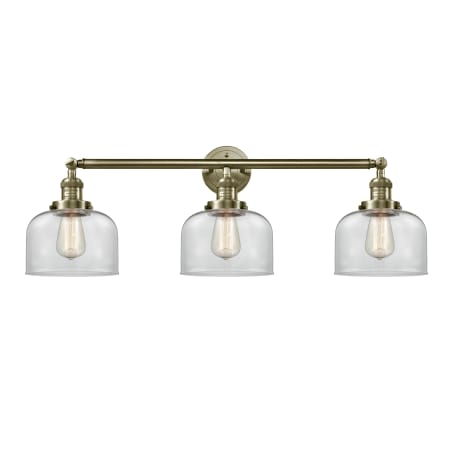 A large image of the Innovations Lighting 205-S Large Bell Antique Brass / Clear