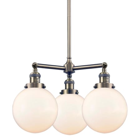 A large image of the Innovations Lighting 207-8 Beacon Antique Brass / Matte White Cased