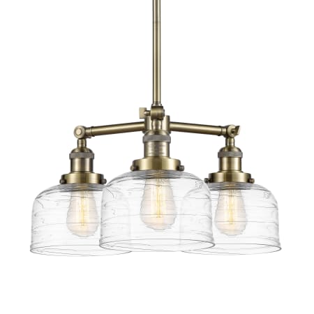 A large image of the Innovations Lighting 207-11-22 Bell Chandelier Antique Brass / Clear Deco Swirl