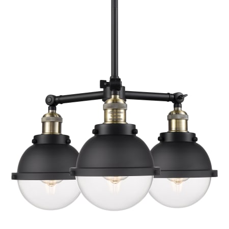 A large image of the Innovations Lighting 207-12-20 Hampden Chandelier Black Antique Brass / Clear