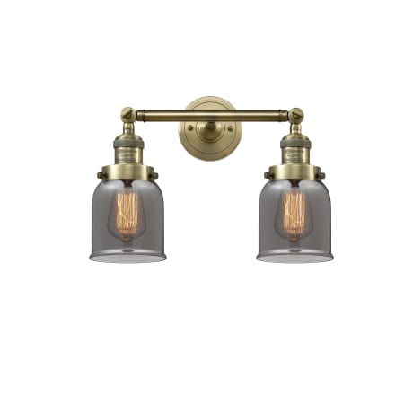 A large image of the Innovations Lighting 208 Small Bell Antique Brass / Smoke