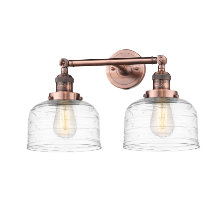 A large image of the Innovations Lighting 208-12-19 Bell Vanity Antique Copper / Clear Deco Swirl