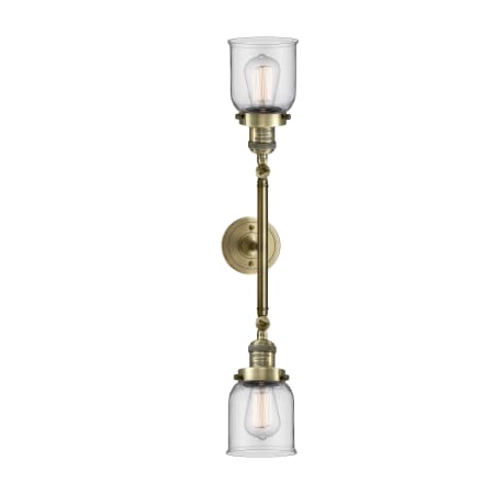 A large image of the Innovations Lighting 208L Small Bell Antique Brass / Clear