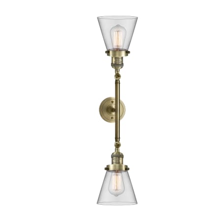A large image of the Innovations Lighting 208L Small Cone Antique Brass / Clear